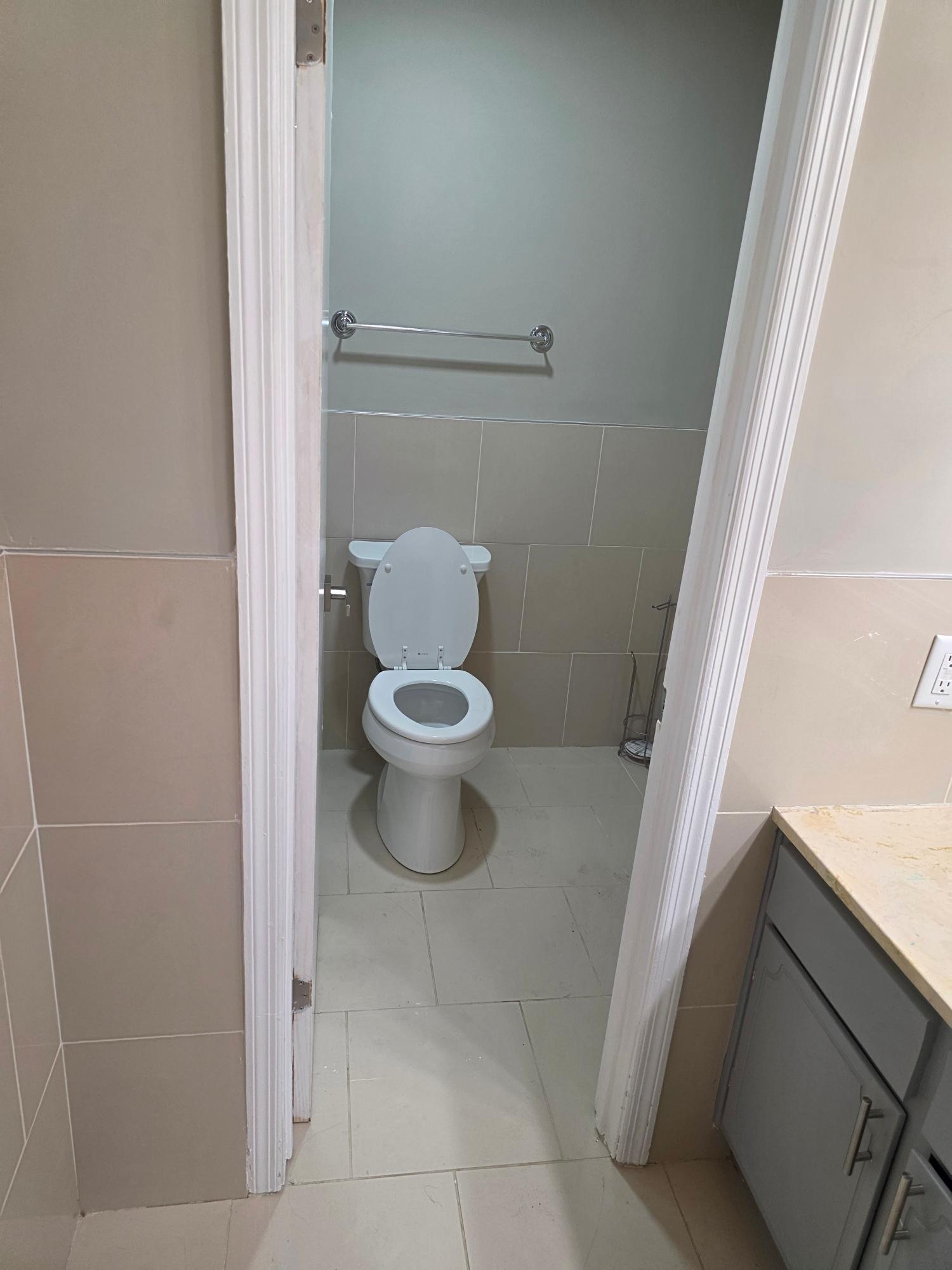 Powder room with tile surround