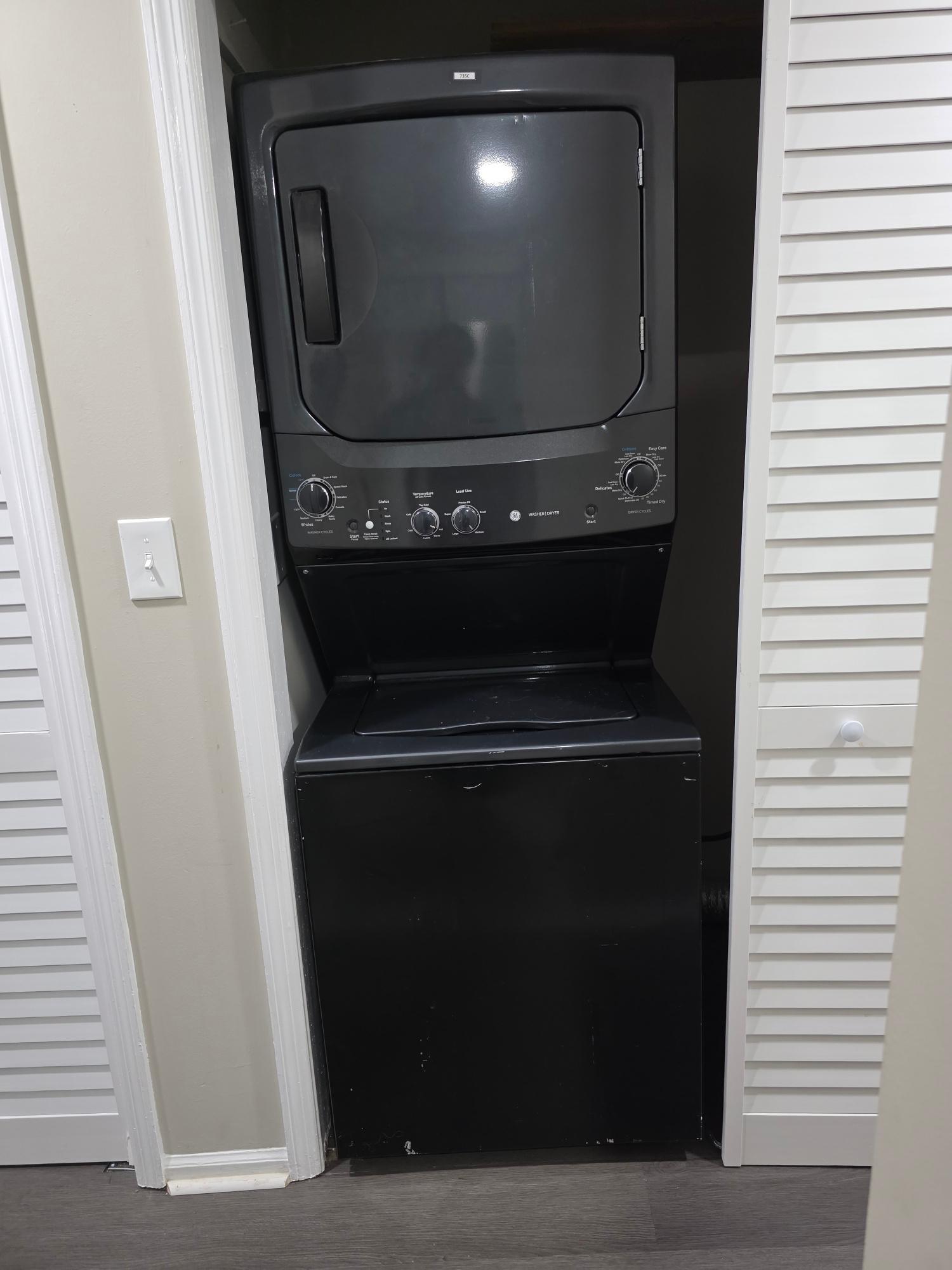 In-unit stacked washer and dryer closet