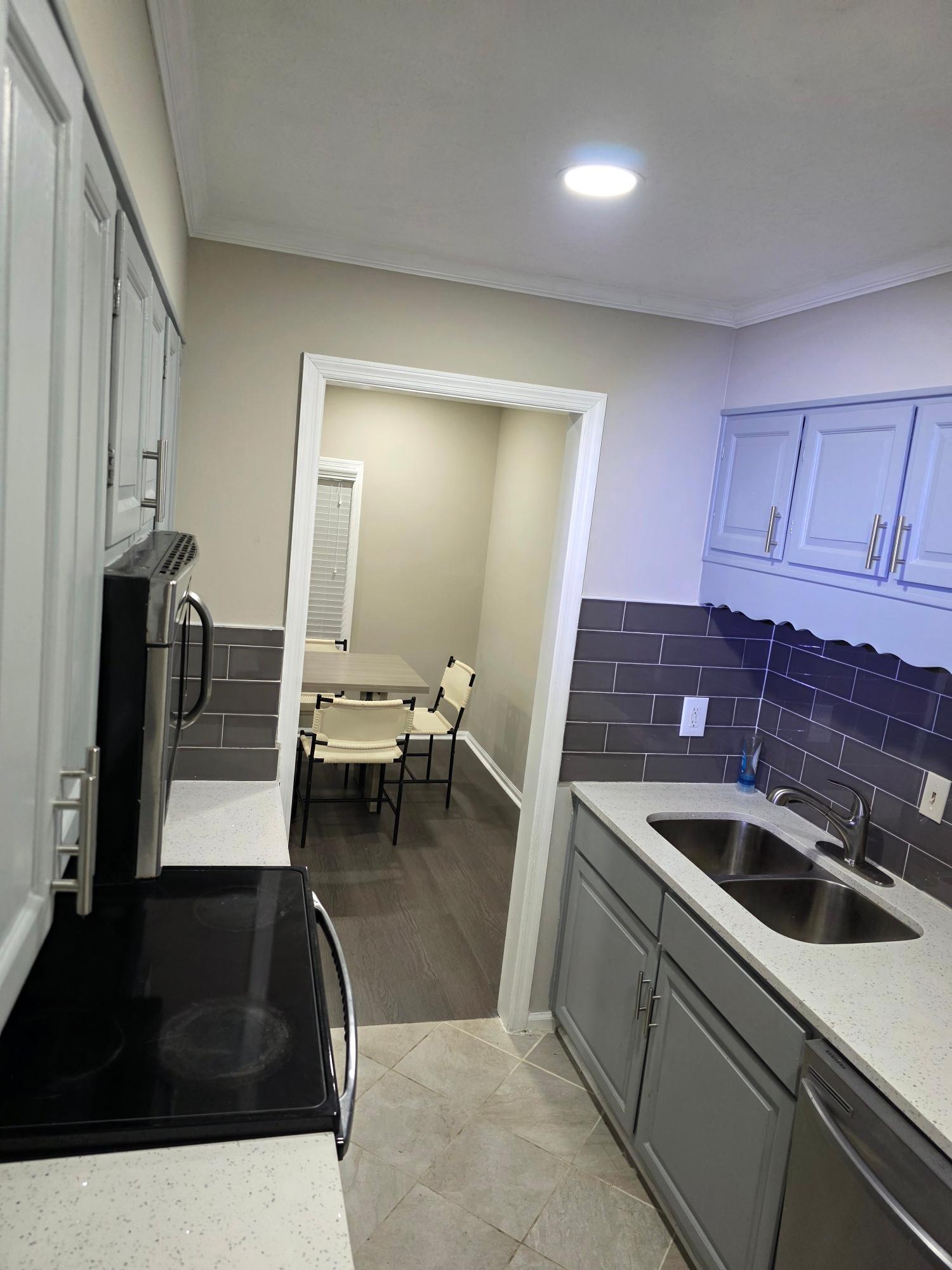 Kitchen range and pass-through to dining nook