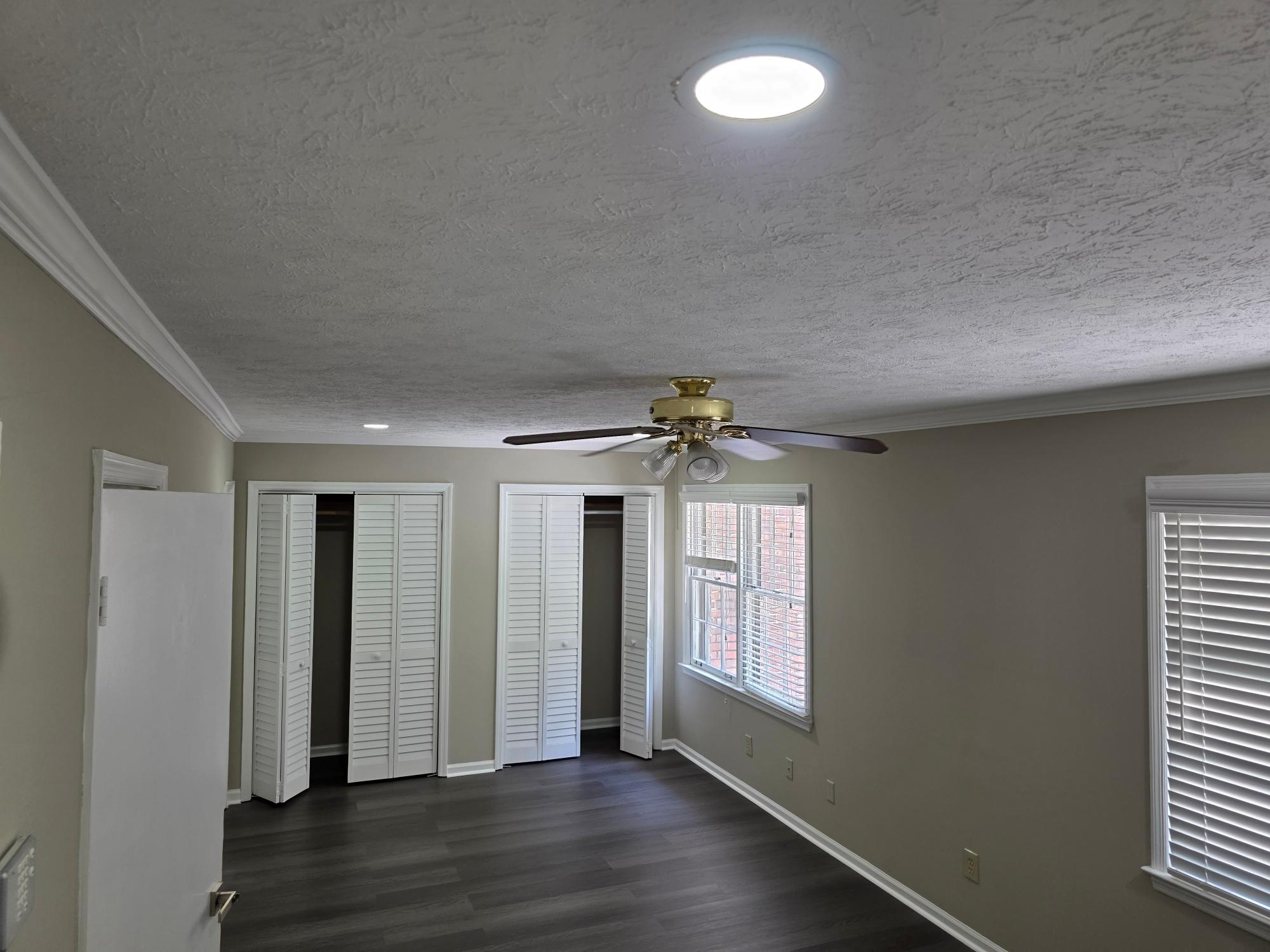 Primary bedroom with double closets and natural light