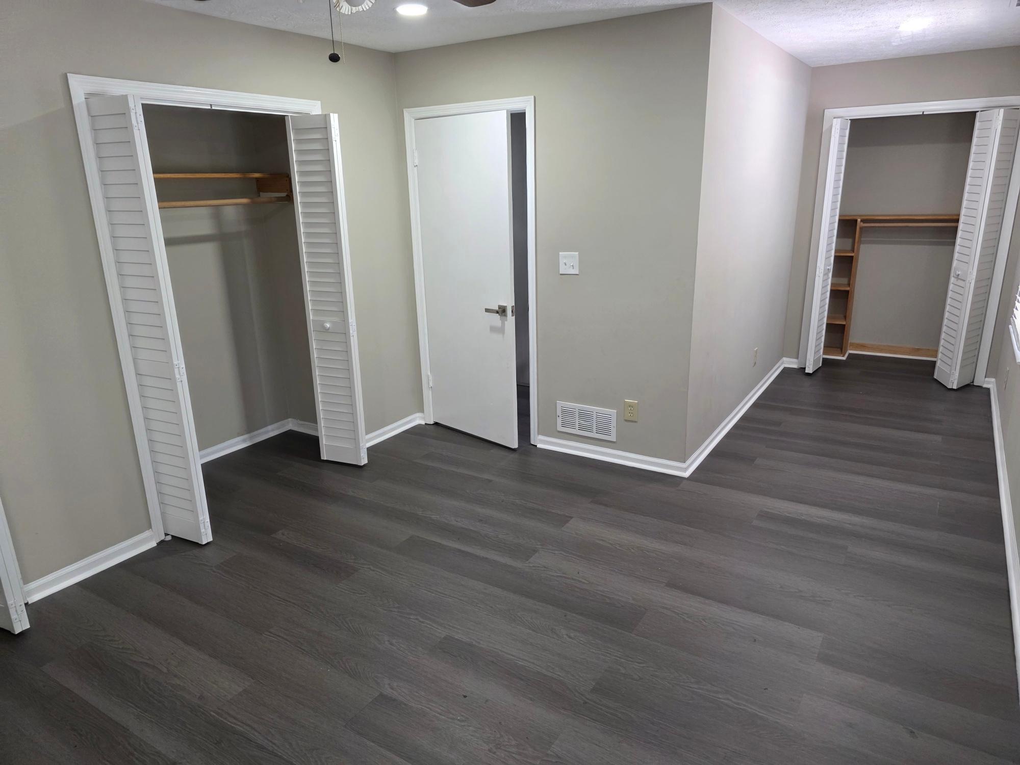 Upstairs bedroom hallway with two closets